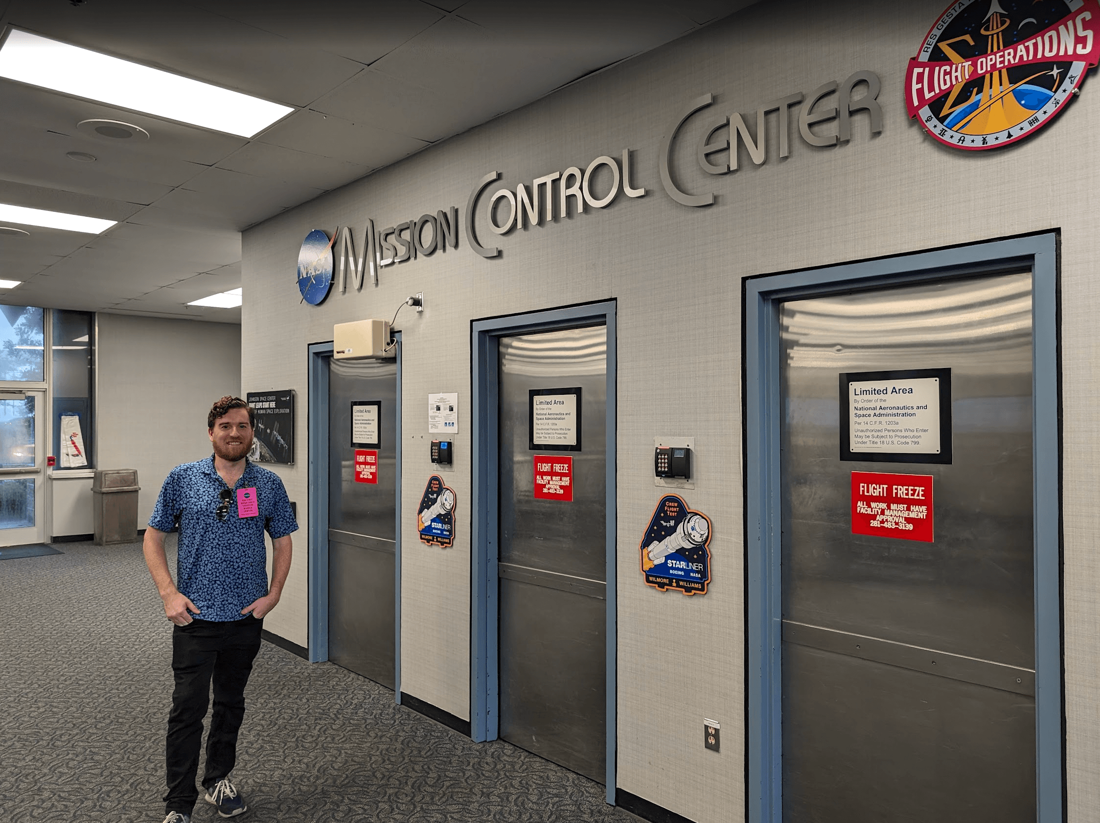 Jim Washkau standing at NASA Mission Control Center