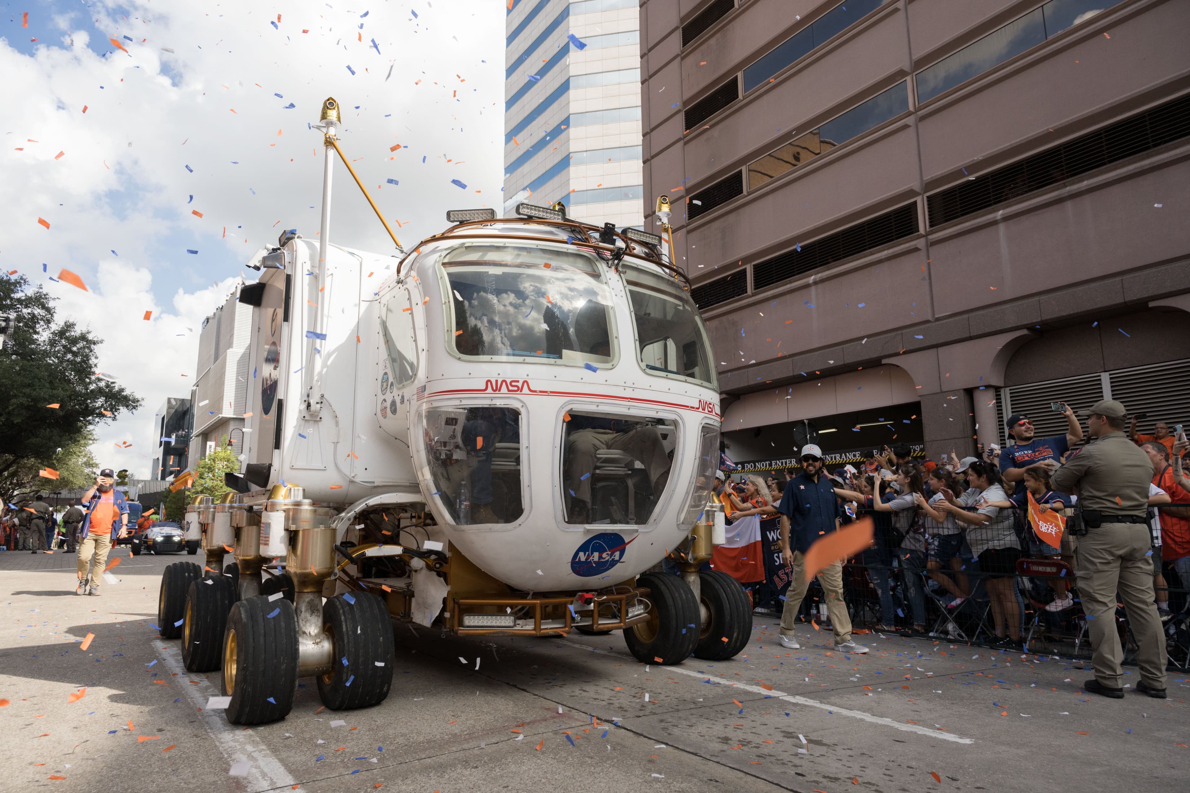 Concept image of a NASA lunar terrain vehicle moving through a public event parade