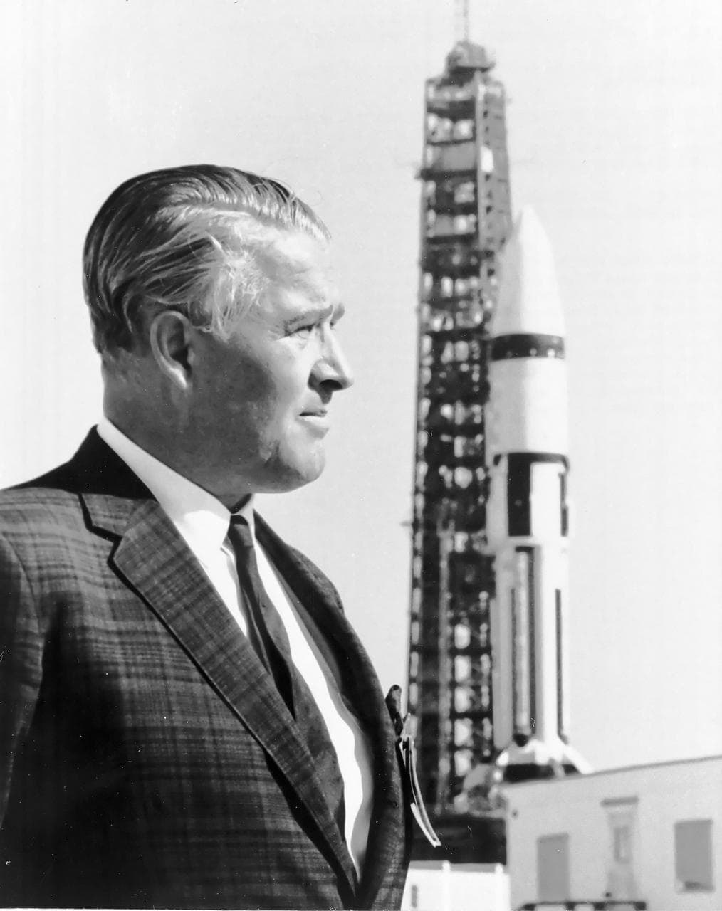 Wernher von Braun in profile beside a Saturn IB rocket at Kennedy Space Center in 1968